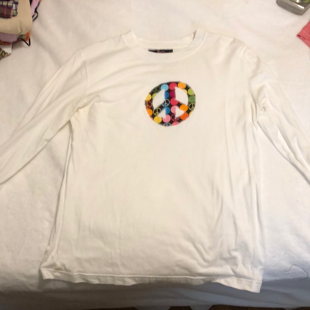 white peace sign shirt